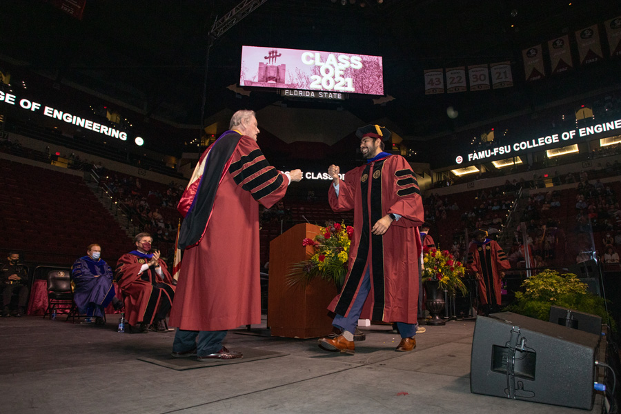 President Thrasher congratulates a newly minted Ph.D. graduate during FSU Spring Commencement Friday, April 23, 2021. (FSU Photography Services)