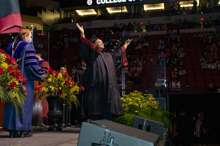 A graduate celebrates at FSU Spring Commencement Friday, April 23, 2021. (FSU Photography Services)