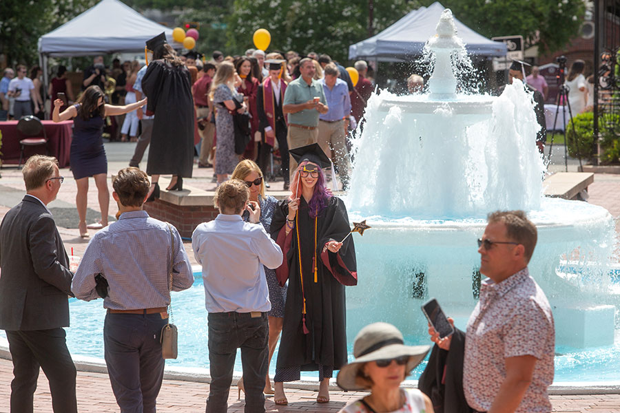 Graduates and their guests celebrate at Westcott Fountain after enjoying a special in-person commencement ceremony for 2020 graduates Saturday, May 22, 2021, at the Donald L. Tucker Civic Center. (FSU Photography Services)