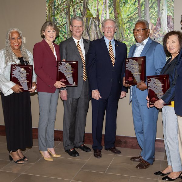 From left to right: Janet Kistner, vice president for faculty development and advancement, Doby Flowers, Paula Peters Smith, Bill Godfrey Smith, John Thrasher, Fred Flowers, Dorothy Jenkins and her husband Charles Jenkins.