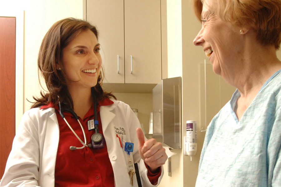 In this file photo, Dr. Christie Alexander, an associate professor at the Florida State University College of Medicine, visits a patient. (Florida State University)