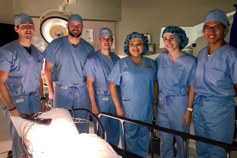 Dr. Stacey VanDyke (center) with NAP students at clinical site.