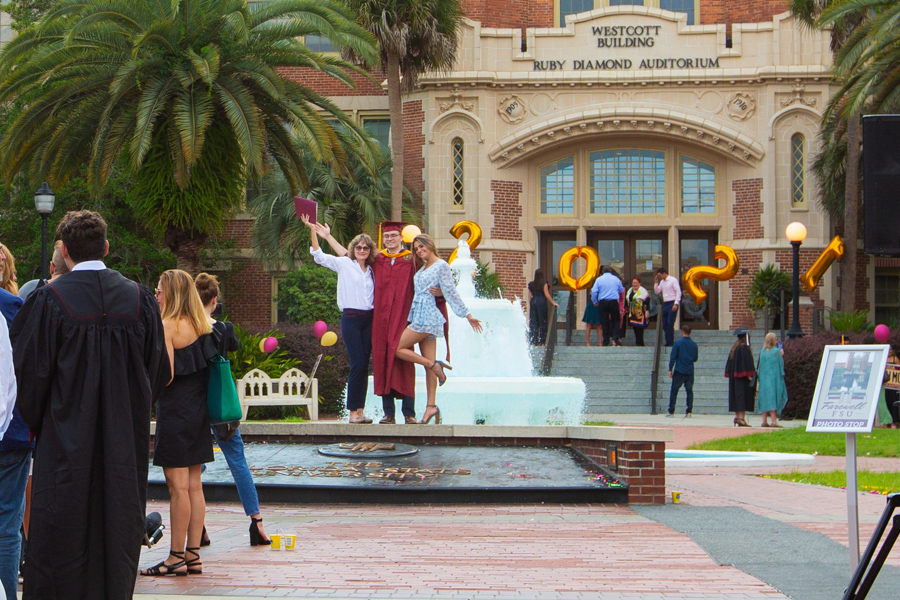 FSU graduates celebrate their farewell on Westcott Plaza after commencement ceremonies Friday at the Tucker Civic Center. (FSU Photography Services)