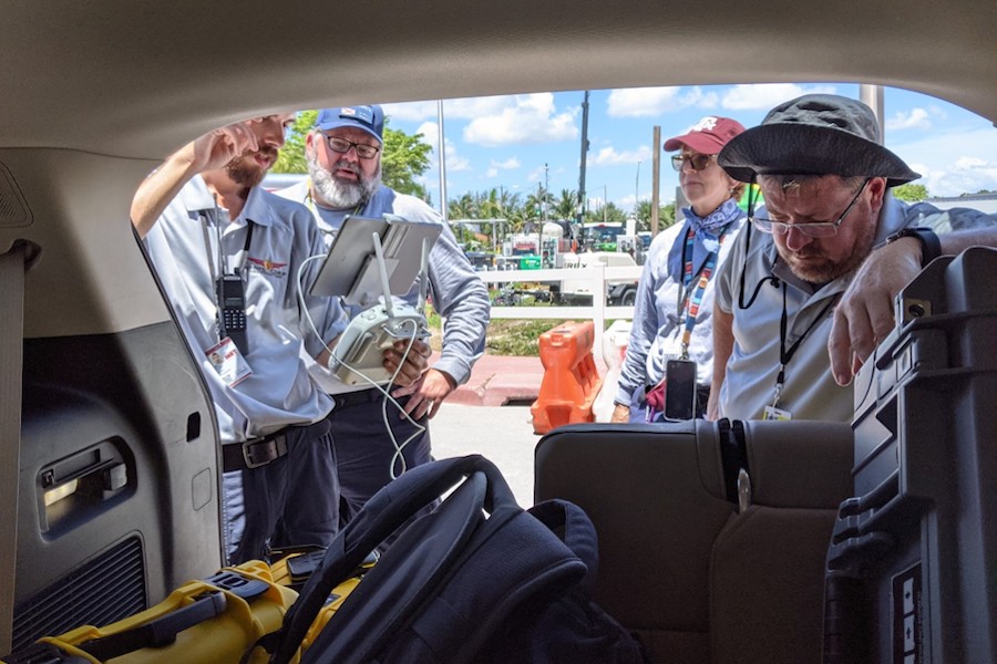 CDRP team members plan flights on July 4, 2021, prior to the demolition of the remainder of the Champlain Towers, which collapsed in Surfside, Florida in 2021. Pictured from left to right: Ph.D. researcher Austin Bush, CDRP Director David Merrick, Dr. Robin Murphy, of Texas A&M University and FSU researcher Justin Adams.