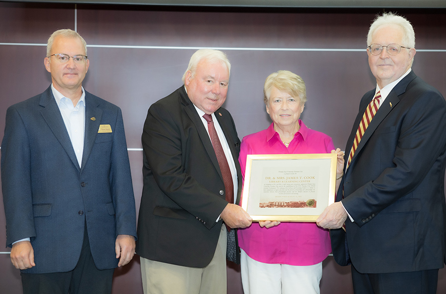 (From L to R) FSU PC University Librarian Shaun Saxon, Dr. Jim and Jan Cook and FSU PC Dean Randy Hanna announcing the naming of the Library and Learning Center as the “Dr. and Mrs. James T. Cook Library and Learning Center.”