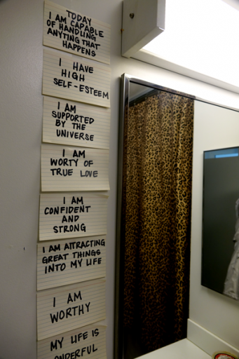 Bathroom wall used to support a therapy exercise by a formerly unhoused client in California.