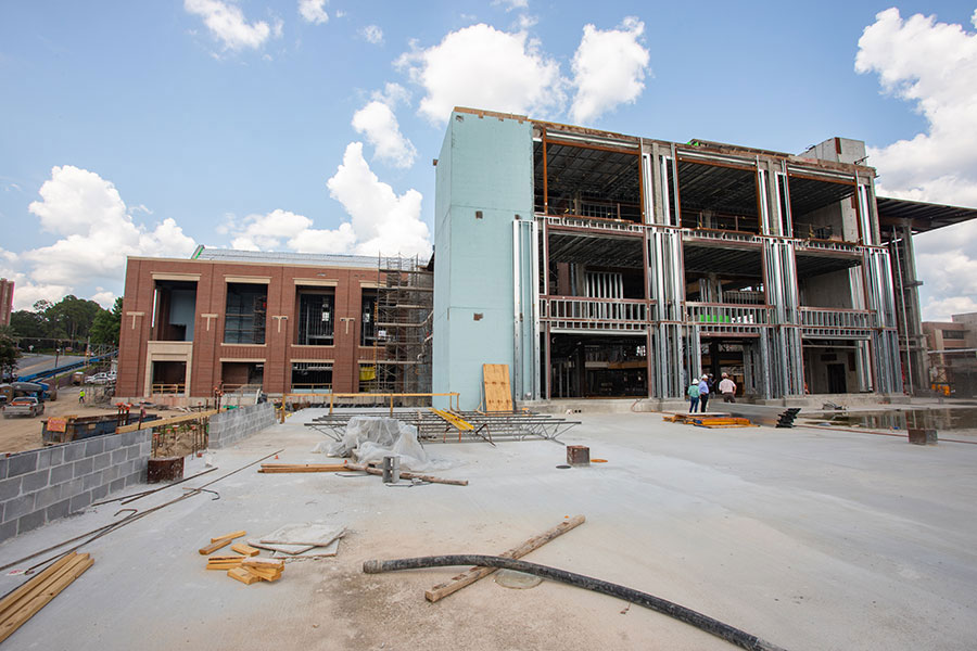 A grid of scaffolding now covers the south side of the Union. Workers are set to add the exterior of red bricks found throughout campus.