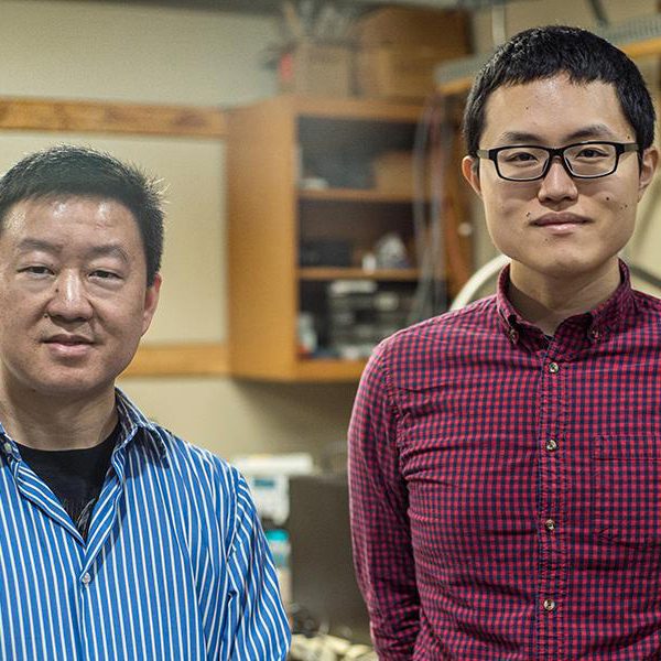 From left, Wei Guo, associate professor in mechanical engineering at the FAMU-FSU College of Engineering, and Toshiaki Kanai, a graduate research student working with Guo at the National High Magnetic Field Laboratory. (Photo by Stephen Bilenky/National MagLab)