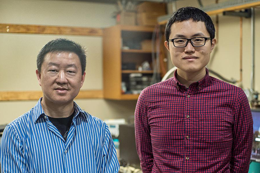 From left, Wei Guo, associate professor in mechanical engineering at the FAMU-FSU College of Engineering, and Toshiaki Kanai, a graduate research student working with Guo at the National High Magnetic Field Laboratory. (Photo by Stephen Bilenky/National MagLab)