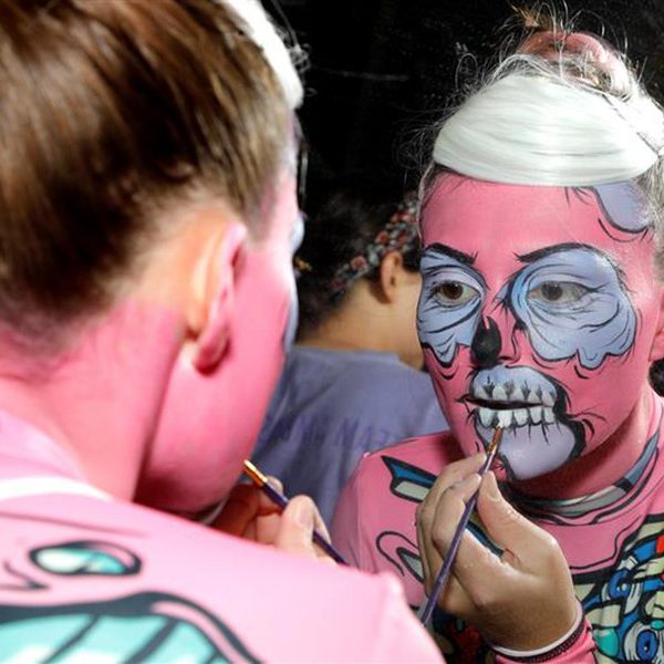 Maddie Hammer backstage doing her own pop zombie makeup for the opening dance routine.