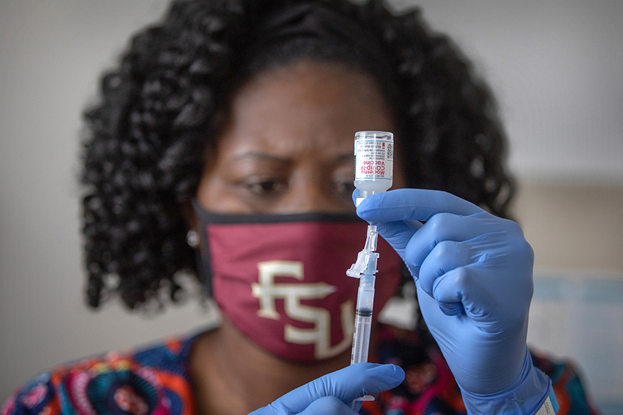 Latricia Simmons, RN, Assistant Director of Clinic Operations at University Health Services draws up a dose of the Covid-19 vaccine Jan. 8, 2021. (FSU Photography Services)