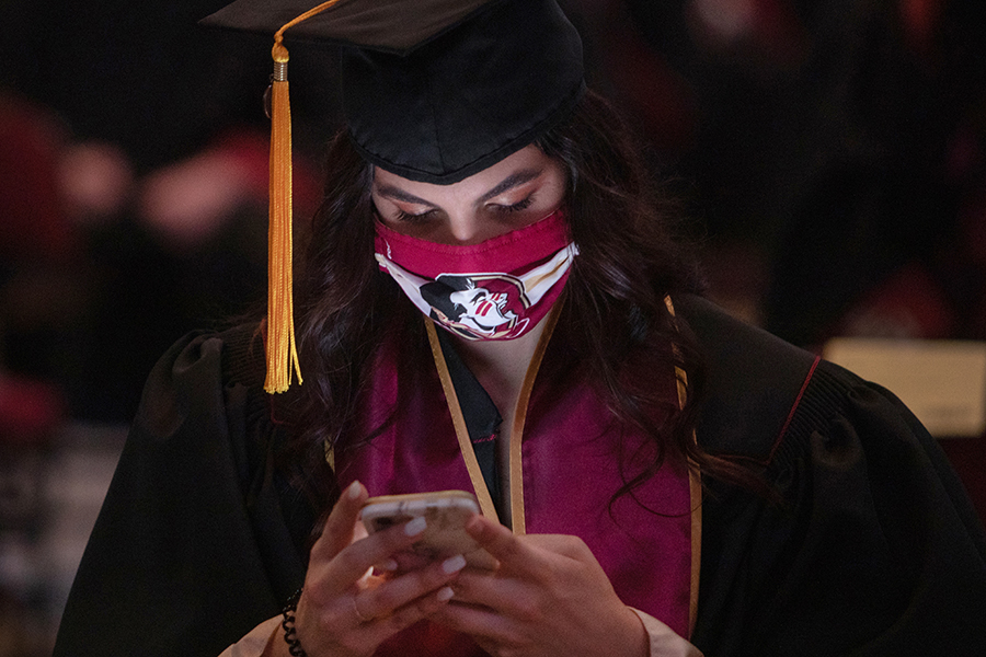 A Florida State University graduate gets ready for one of 11 in-person commencement ceremonies held in April 2021. (FSU Photography Services)