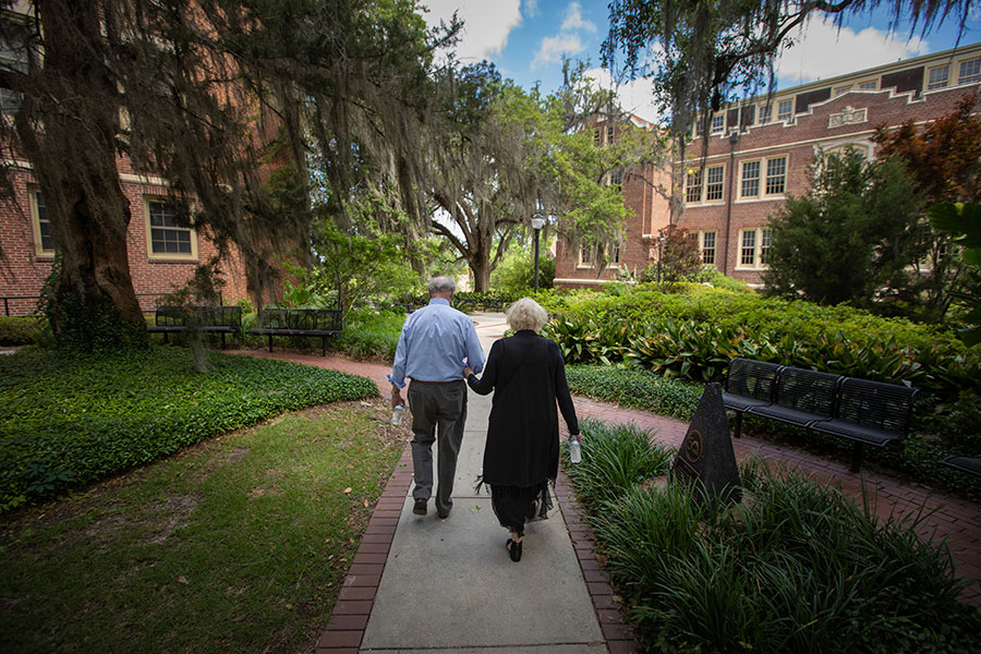 President John Thrasher and FSU First Lady Jean Thrasher stroll on campus after the university's final spring commencement ceremony May 22, 2021. (FSU Photography Services)