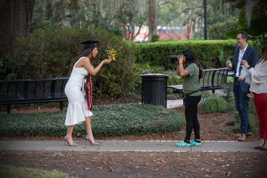 Florida State University graduates taking photos in the Westcott Plaza. (FSU Photography Services)