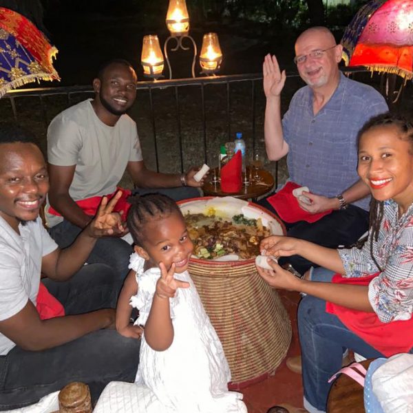 Gunderson enjoying dinner with family in Tanzania, East Africa.