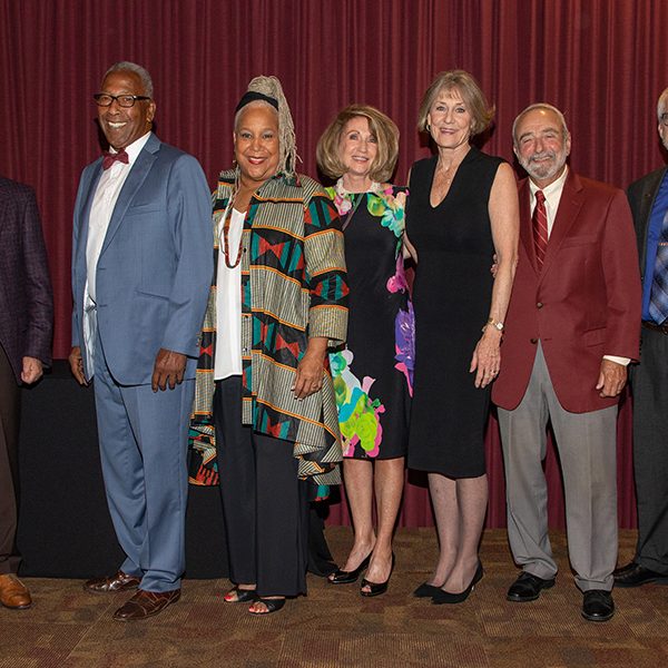 Photo caption: 2021 and 2020 Torch Award recipients were recognized at the Torch Awards ceremony March 3. (From L to R) FSU Provost Jim Clark, Fred Flowers, Doby Flowers, Virginia Wetherell Scott, Paula Peters Smith, Greg Beaumont and Faculty Senate President Eric Chicken. Not pictured is Warrick Dunn who was unable to attend the ceremony. (FSU Photography Services)