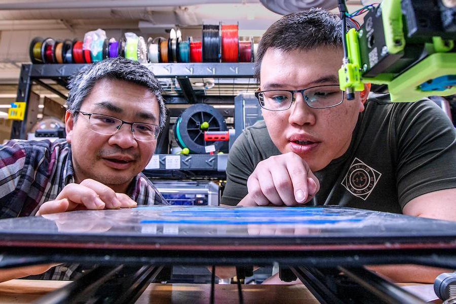 Hui Wang, left, associate professor of industrial engineering and An-Tsun Wei, a Ph.D. student, are the co-authors of a paper detailing how learning cloud data collected from interconnected 3D printers improves quality control and printing accuracy. (M Wallheiser/FAMU-FSU Engineering)