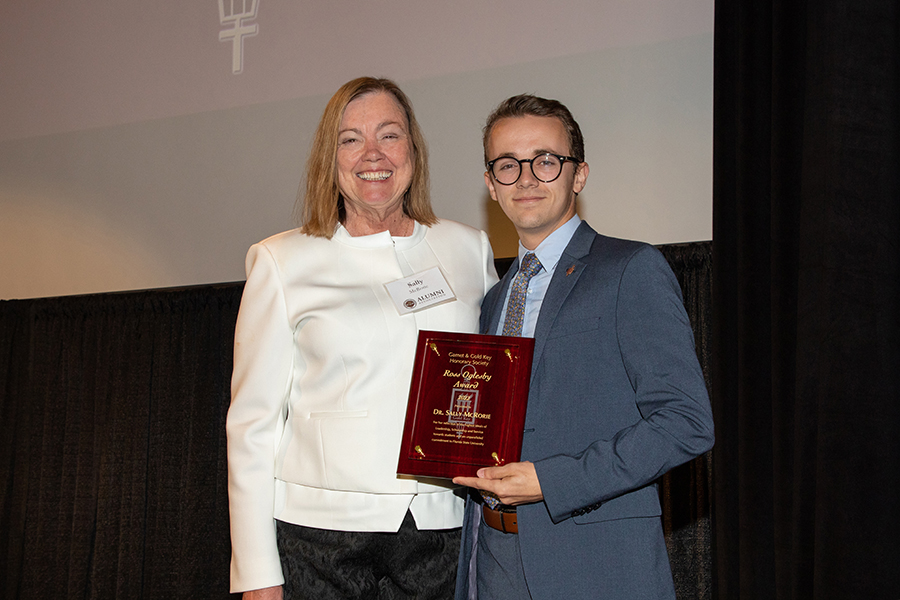 Sally McRorie presented with Garnet and Gold Key’s Ross Oglesby Award by the new Garnet and Gold Key President, Alexander Harmon.