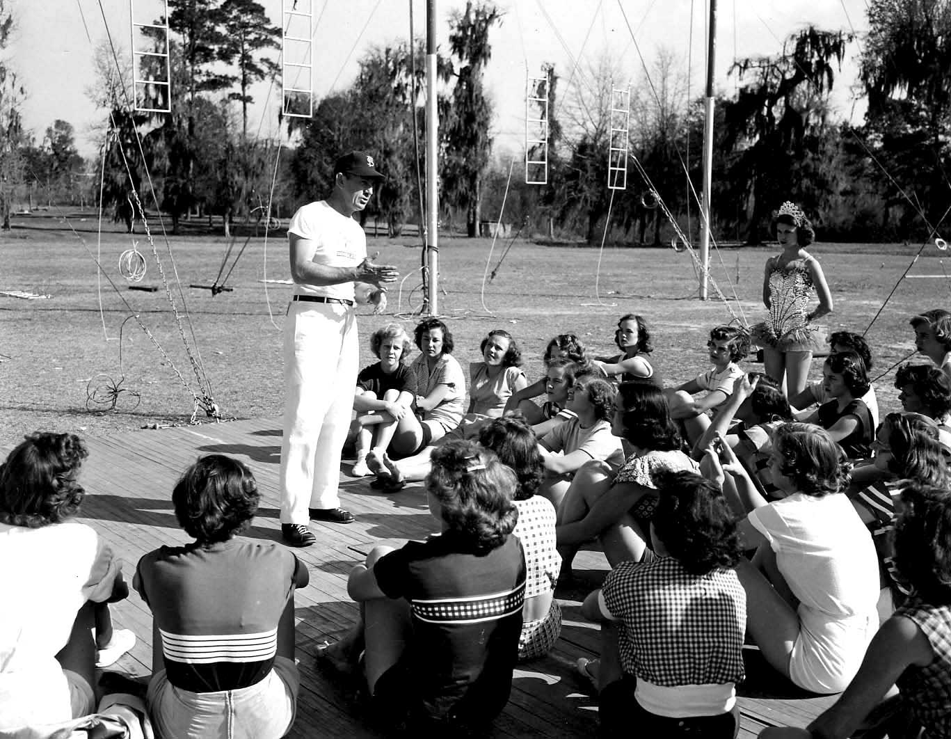 Jack Haskin, founder of the FSU Flying High Circus, instructs students during a practice in 1951. (FSU Special Collections & Archives)