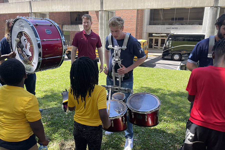 Boys & Girls Clubs of the Big Bend tried various instruments during a hands-on educational program before the PRISM concert.