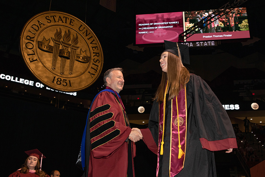 President McCullough congratulates a graduate during FSU spring commencement April 29, 2022. (FSU Photography Services)