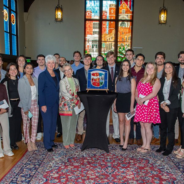 Jan Moran and Susan Fiorito (middle), along with students from the Jim Moran College of Entrepreneurship, celebrate the dedication of the newest stained-glass window in Dodd Hall’s Heritage Museum April 13, 2022. (FSU Photography Services)