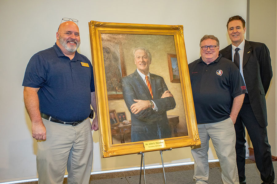Bill Lax and Bruce Palmer, photographers from FSU Photography Services, with portrait artist Paul Newton at the unveiling ceremony April 25, 2022. (FSU Photography Services)