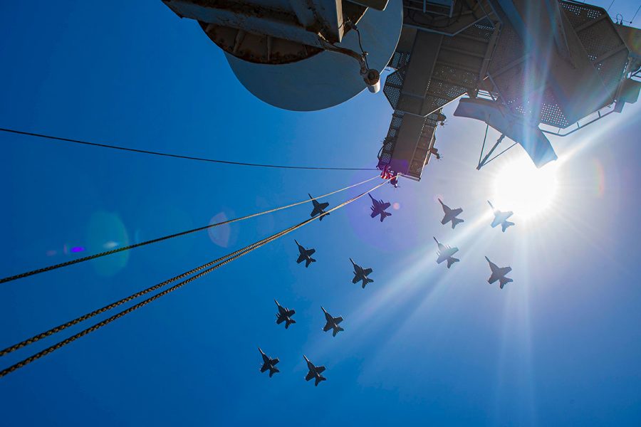 Navy F/A-18E Super Hornet fighter jets fly in formation over the USS Dwight D. Eisenhower in the Atlantic Ocean, July 13, 2021. (Navy Petty Officer 3rd Class Brianna T. Thompson-Lee)