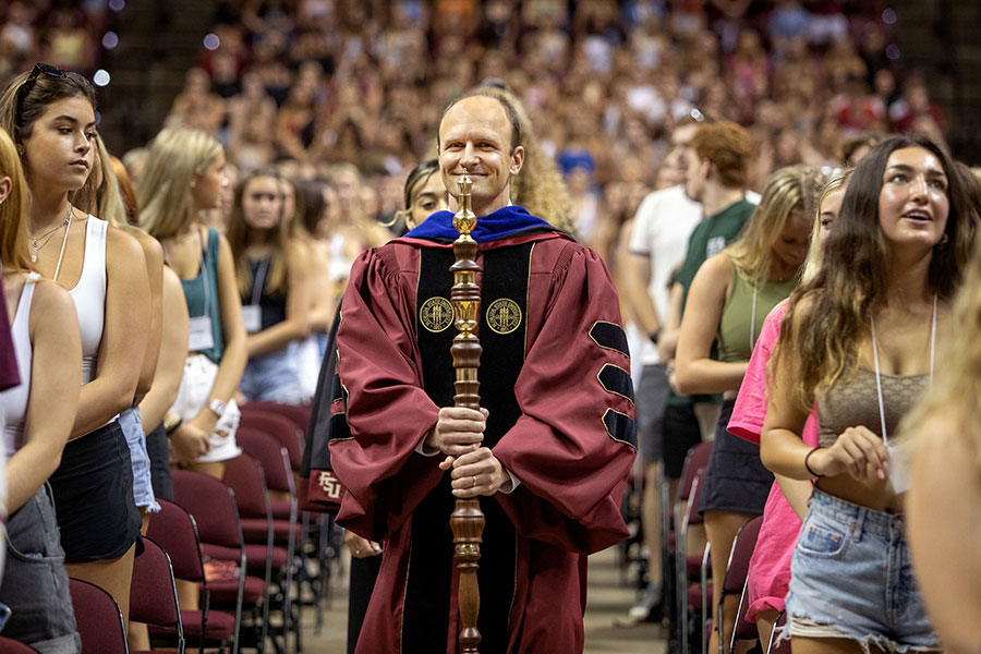 Florida State University Dean of Undergraduate Studies Joe O'Shea carries the mace at New Student Convocation on Aug. 21, 2022, at the Donald L. Tucker Civic Center. (FSU Photography Services)