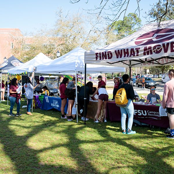 FSU students visiting campus partner booths during Fresh Check Day 2021 on Landis Green.