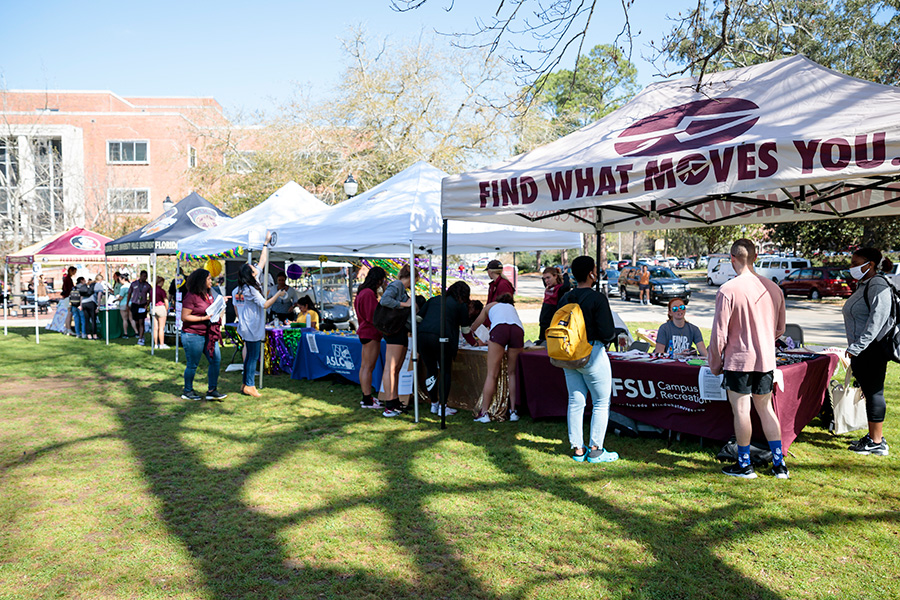 FSU students visiting campus partner booths during Fresh Check Day 2021 on Landis Green.
