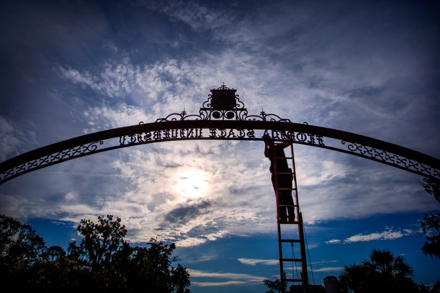 Work gets done on the arch above the Westcott entrance (FSU Photography Services/Bruce Palmer)