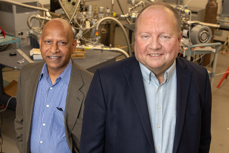 From left, Center for Advanced Power Systems Associate Director Sastry Pamidi and Director Roger McGinnis in a lab at the CAPS facility. (Bruce Palmer/FSU Photography Services)