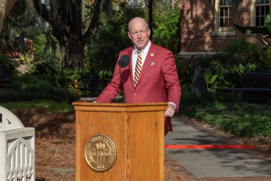 FSU Board of Trustees Chair Peter Collins addresses attendees at the dedication ceremony of a statue for President Emeritus John Thrasher on Saturday, Nov. 19, 2022, at Westcott Plaza. (FSU Photography Services)