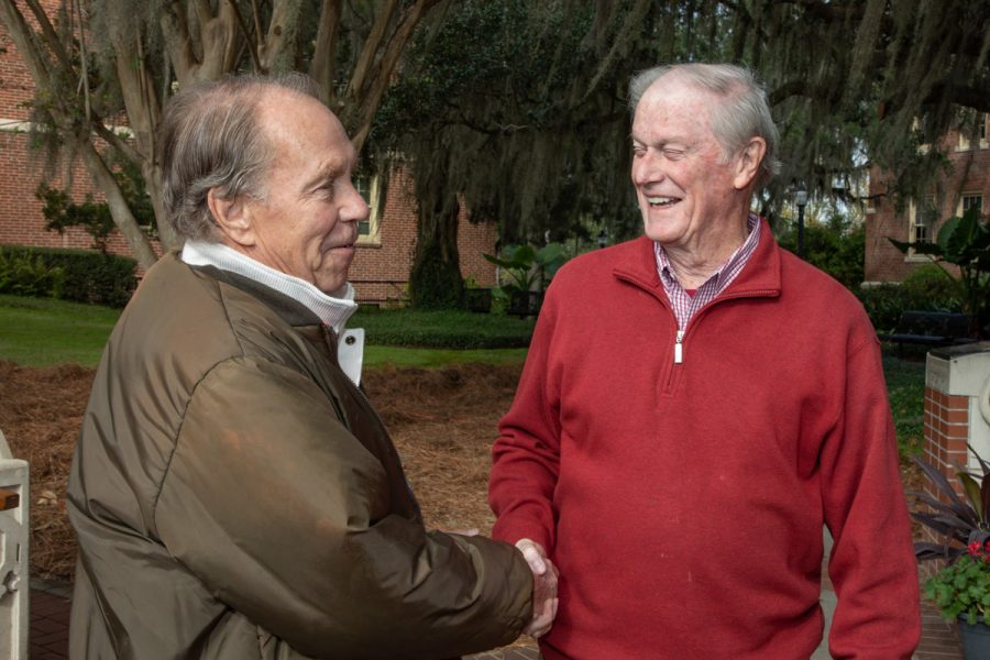 President Emeritus John Thrasher and W. Stanley “Sandy” Proctor, statue artist, shake hands following the dedication ceremony Saturday, Nov. 19, 2022, at Westcott Plaza. (FSU Photography Services)