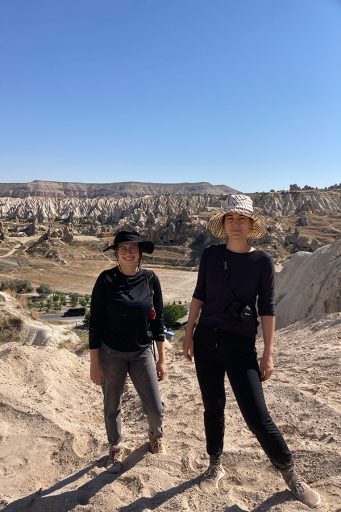 Graduate students Maddie Gilmore-Duffey and Caitlin Mims pose for a photo in Cappadocia while researching the regions rock-cut churches.