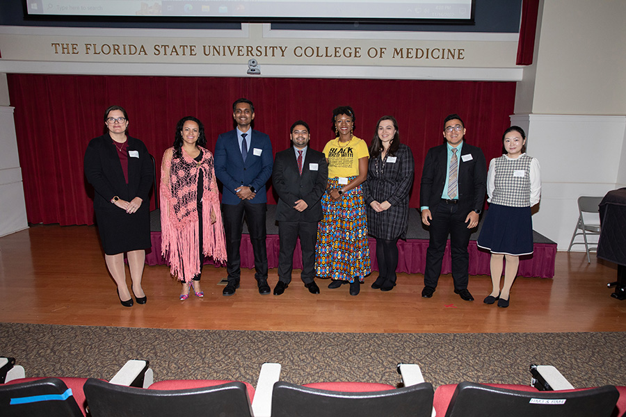 The 2022 FSU 3MT competition finalists: M. Addie McConomy, Special Education; Vivianne Asturizaga, Musicology; Akshay Anand, Mechanical Engineering; Susmit S. Gulavani, Sport Management; Dionne Gerri Wilson, Teacher Education; Rachel Flemming, Spanish Linguistics; Muhamad Prabu Wibowo, Information Science; and Sen Wang, Reading Education and Language Arts. (FSU Photography Services/Bill Lax)