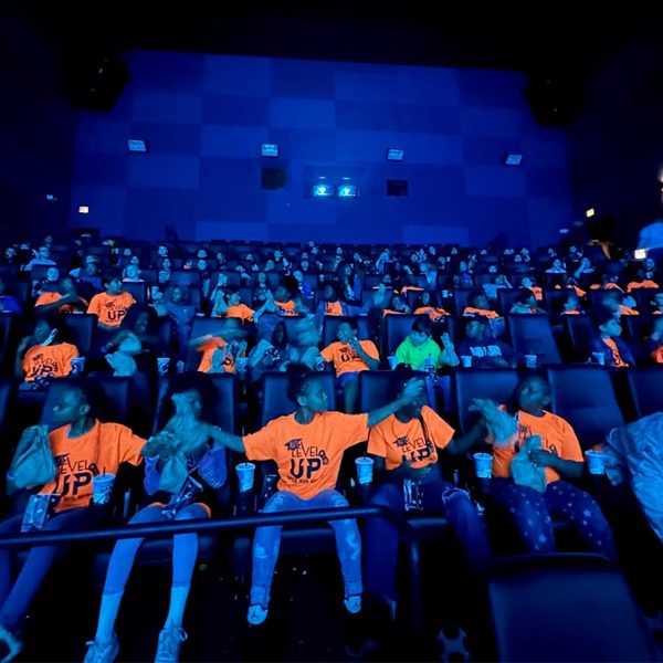 Fifth-grade students from Sabal Palm Elementary School in the IMAX theater at the Challenger Learning Center, the K-12 outreach facility of the FAMU-FSU College of Engineering. Students from several school in Leon County visited the center for a screening of Black Panther: Wakanda Forever and a discussion about the importance of learning STEM subjects. (Courtesy of Challenger Learning Center)