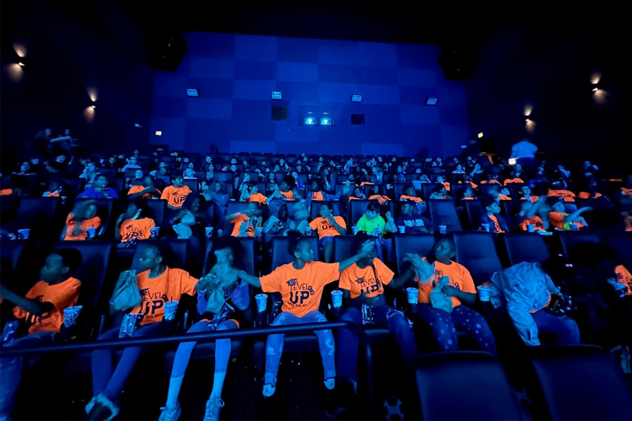 Fifth-grade students from Sabal Palm Elementary School in the IMAX theater at the Challenger Learning Center, the K-12 outreach facility of the FAMU-FSU College of Engineering. Students from several school in Leon County visited the center for a screening of Black Panther: Wakanda Forever and a discussion about the importance of learning STEM subjects. (Courtesy of Challenger Learning Center)