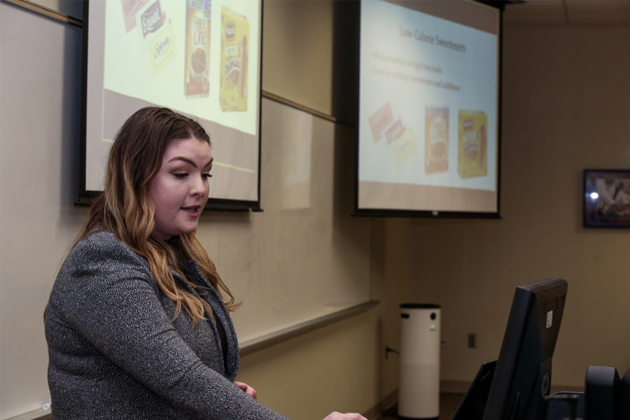 Doctoral candidate Sara Jones, lead author of research examining the effects of aspartame, defending her her doctoral dissertation on the topic. (Mark Bauer/College of Medicine)