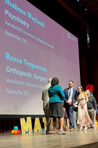 Shalini Wayland and Rhys Vesperman got engaged after a match at Vanderbilt University during match day, March 17, 2023, at the Ruby Diamond Concert Hall.  (Photo by Bob Thomas, College of Medicine)