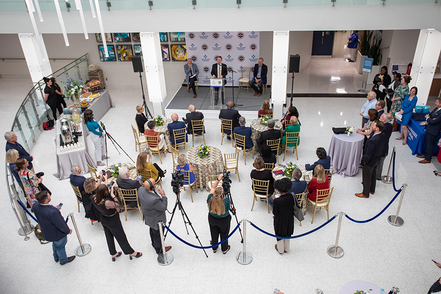 Attendees gather during an announcement of designation of land on which the university will build an academic health center held Wednesday, March 8, 2023, in the Dozier Atrium at TMH. (FSU Photography Services)