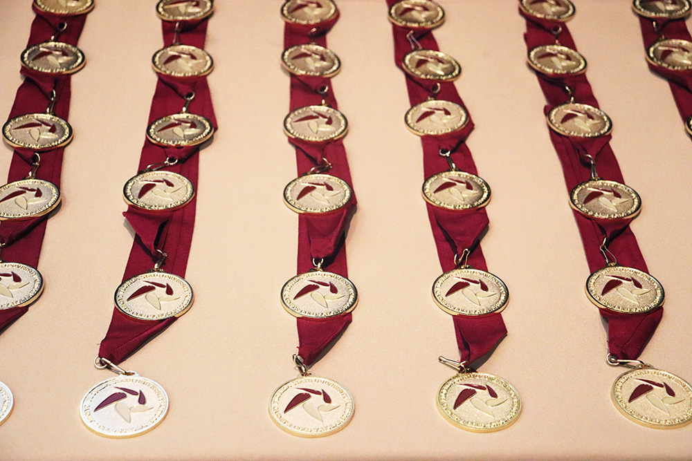 Garnet and Gold Scholar Society medals.