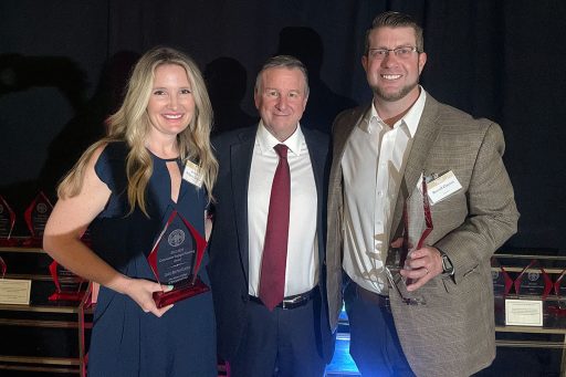Community Engaged Teaching Award winner Jessica Ridgway-Clayton, an assistant professor in the Jim Moran College of Entrepreneurship, President Richard McCullough, and Distinguished Teaching Award honoree Russell Clayton, associate professor in the School of Communication.
