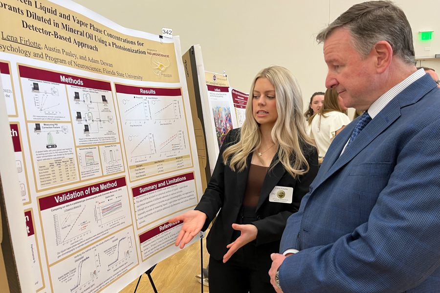 President Richard McCullough visits with student researchers presenting at the 23rd annual Undergraduate Research Symposium in the Student Union ballrooms April 6, 2023. (Hillary Speed, Undergraduate Studies)