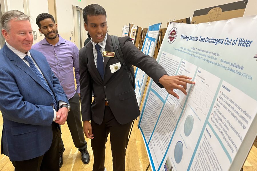 President Richard McCullough visits with student researchers presenting at the 23rd annual Undergraduate Research Symposium in the Student Union ballrooms, April 6, 2023.