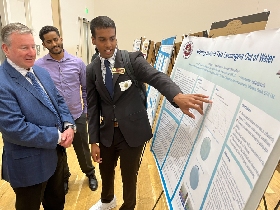 President Richard McCullough visits with student researchers presenting at the 23rd annual Undergraduate Research Symposium in the Student Union ballrooms, April 6, 2023.