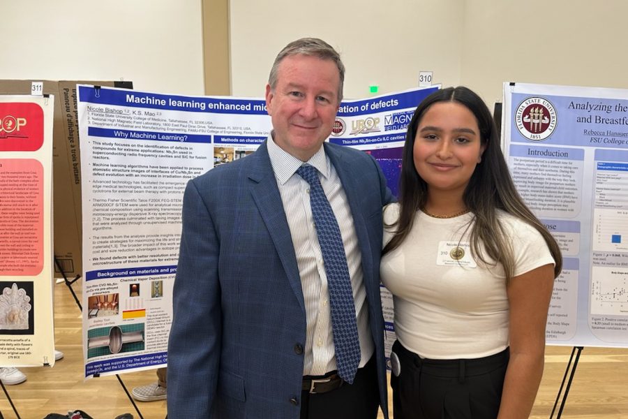 President Richard McCullough visits with student researchers presenting at the 23rd annual Undergraduate Research Symposium in the Student Union ballrooms April 6, 2023.