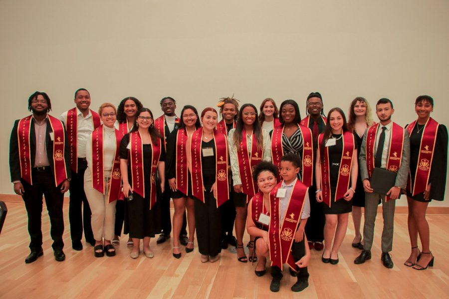 Students from the upcoming graduating class of the Unconquered Scholars Program pose at the annual Unconquered Scholars banquet on March 29 in the Student Union.