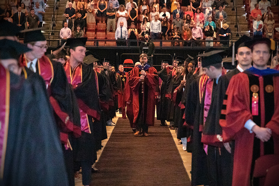 Florida State University Director of Institutional Research James Hunt carries the mace to lead the processional during spring commencement Friday, May 5, 2023, at the Donald L. Tucker Civic Center. (FSU Photography)